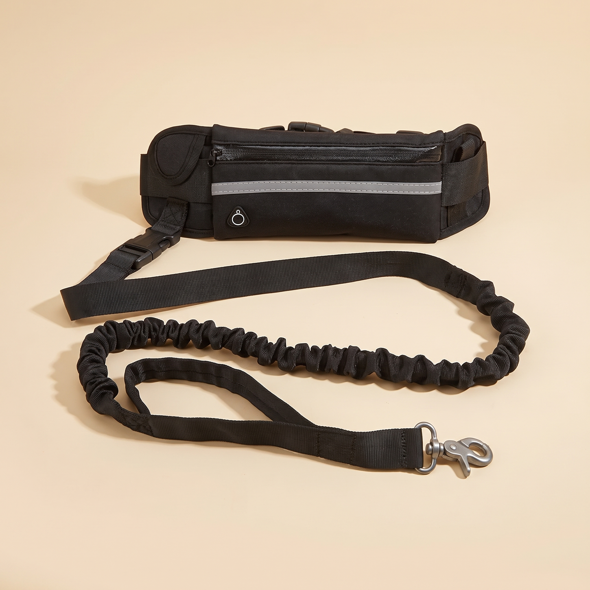 Black hands free dog lead set with waist bag, reflective strip and bungee lead on a plain cream background