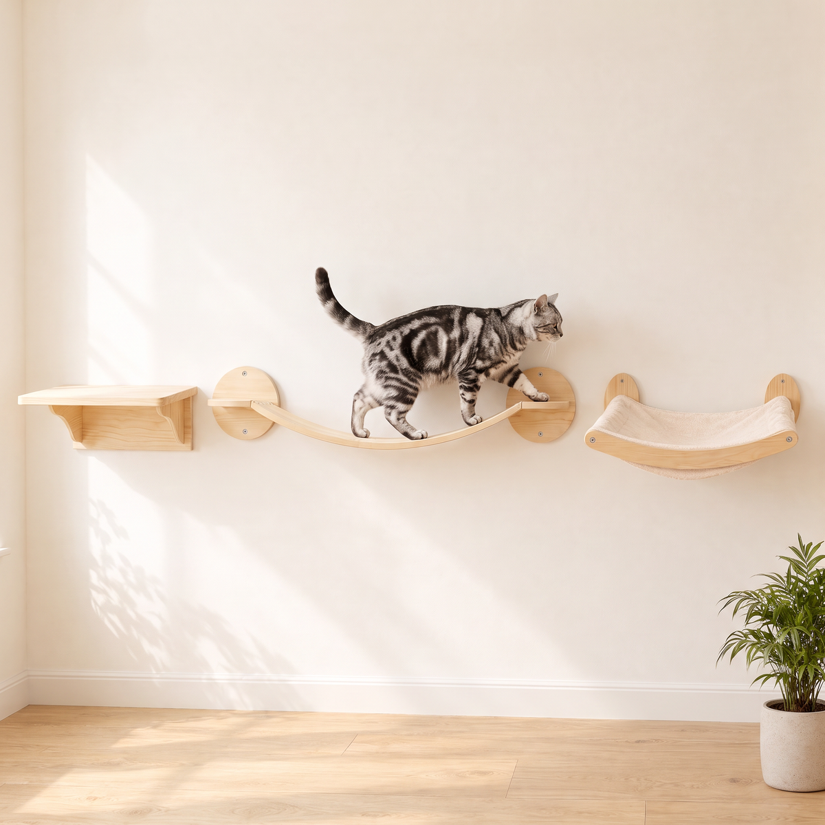 The Bridge Run cat wall set: a silver tabby cat walking along the pale pine wave bridge between the jump shelf and the curved lounger on a cream wall
