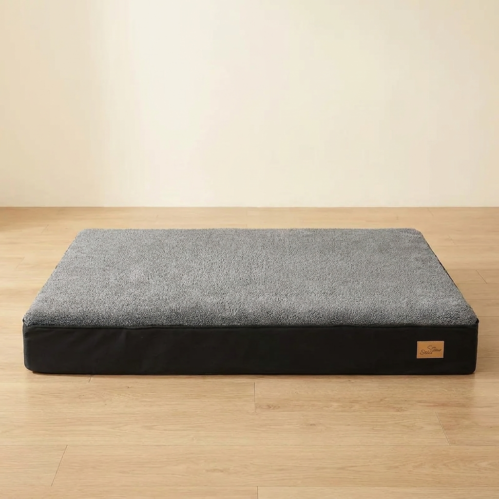 Jumbo orthopedic dog crate mattress on a light oak floor