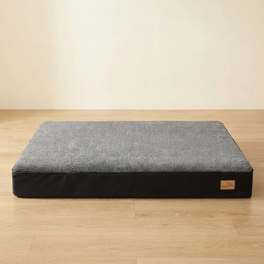 Jumbo orthopedic dog crate mattress on a light oak floor