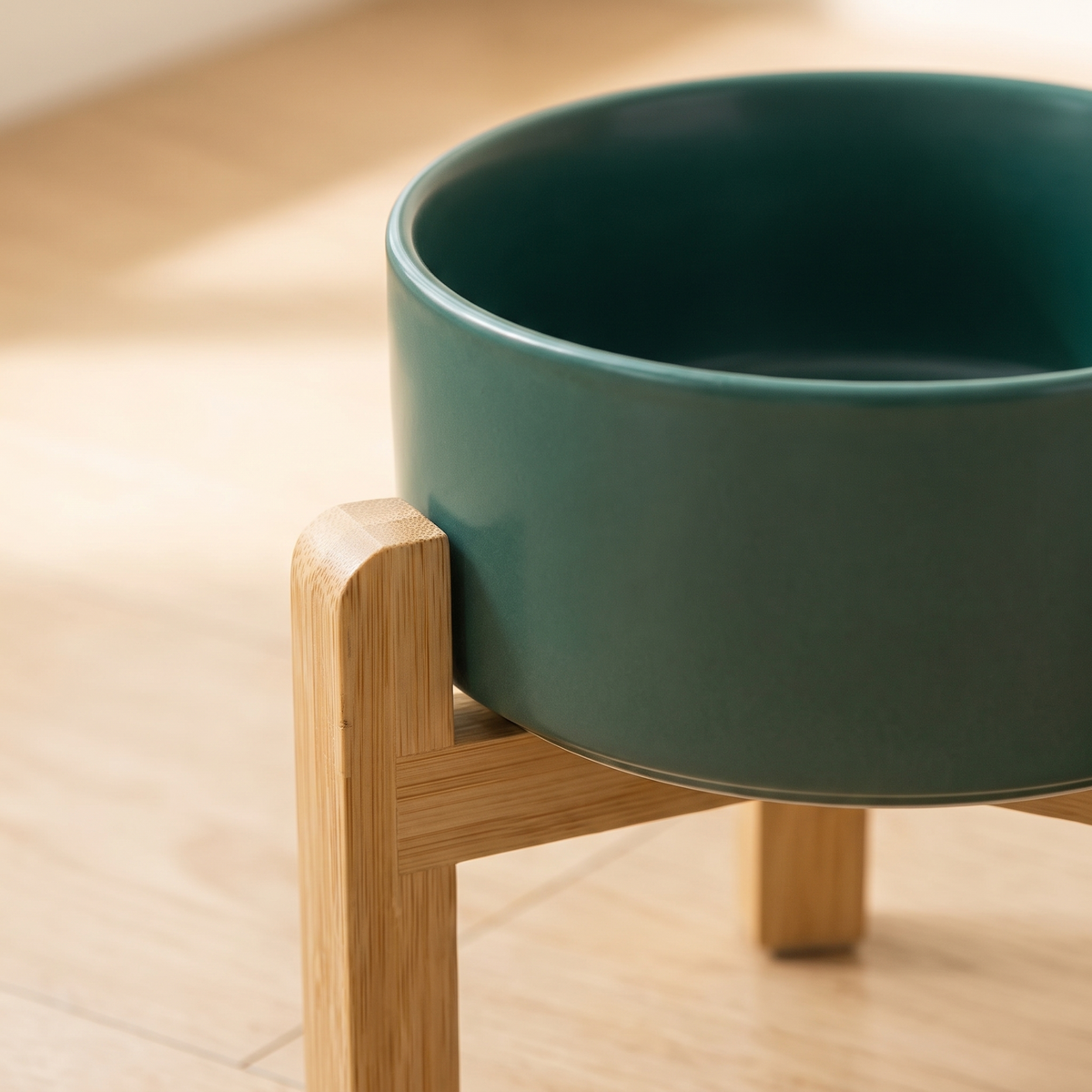 Close-up of glazed ceramic dog bowl and bamboo stand