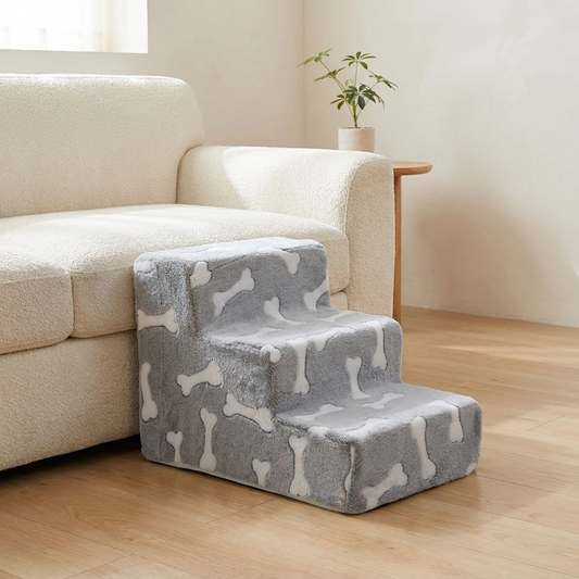 Bone design dog stairs beside a sofa in a warm UK living room