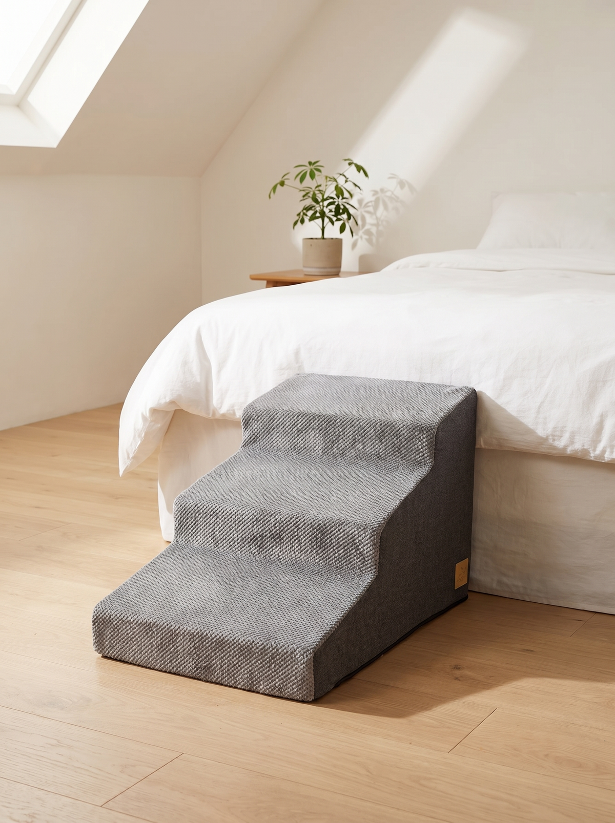 Pet stairs with washable cover beside a sofa in a warm home