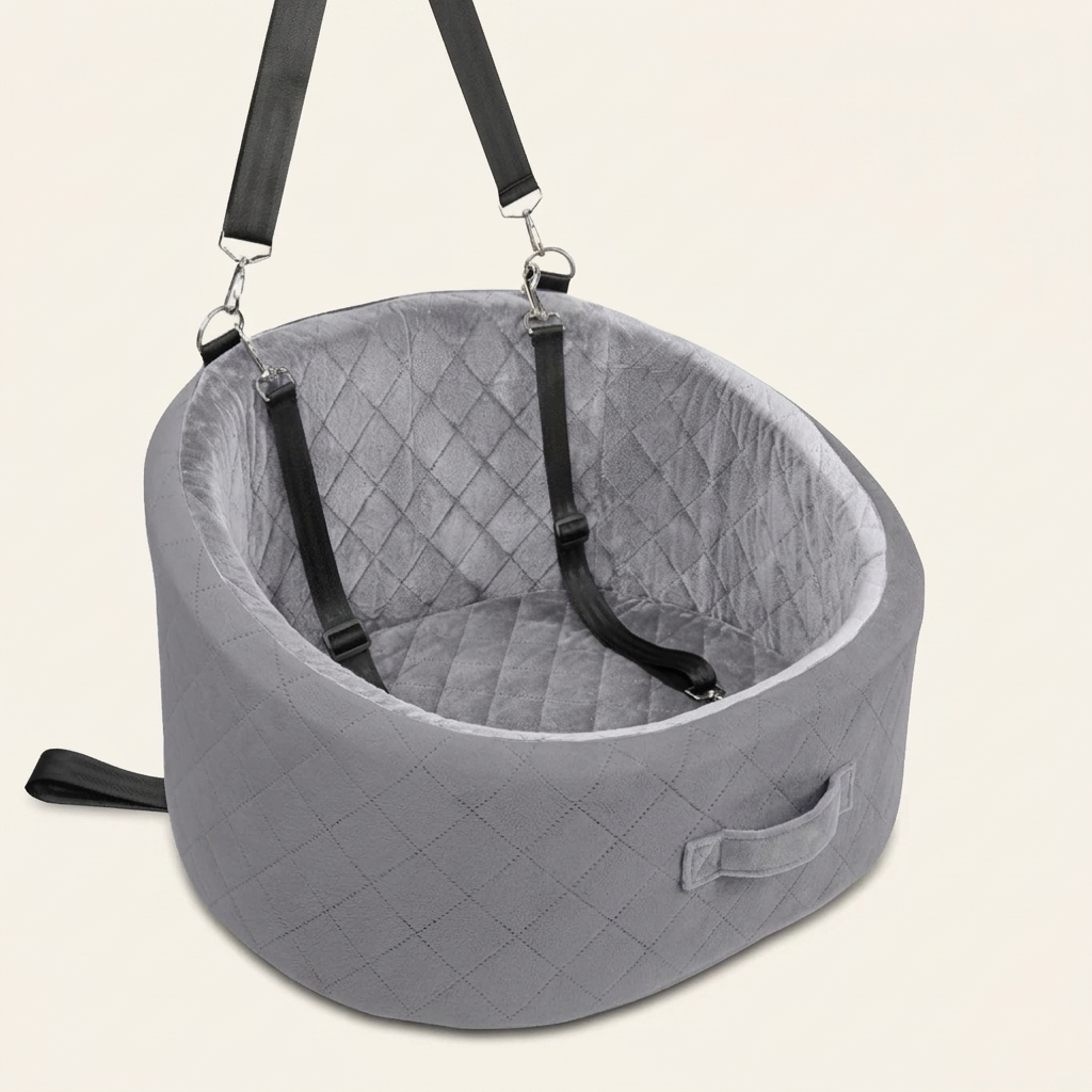 Studio view of the grey quilted pet car booster seat with both straps and carry handle