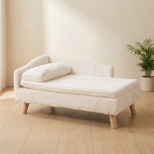 Cream plush elevated pet stool bed with its loose cushion on four pale wooden legs