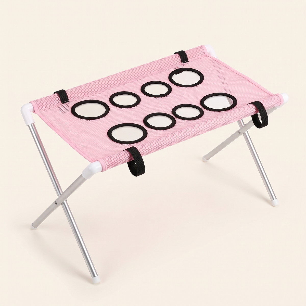 Foldable pink dog bath hammock stand with eight leg openings on a plain cream background