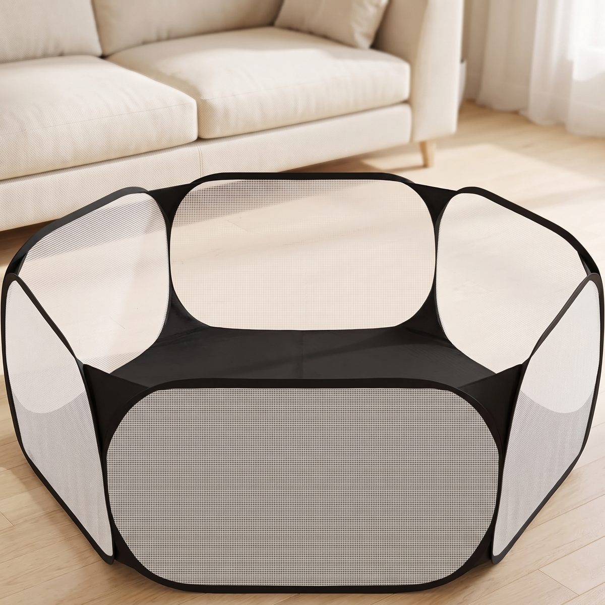 Black hexagonal pop up pet playpen with white mesh panels on a living room floor