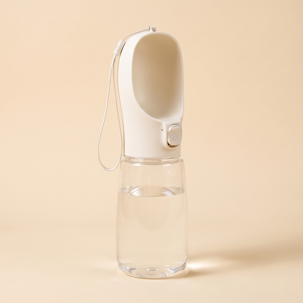 White 550ml portable dog water bottle on a cream background