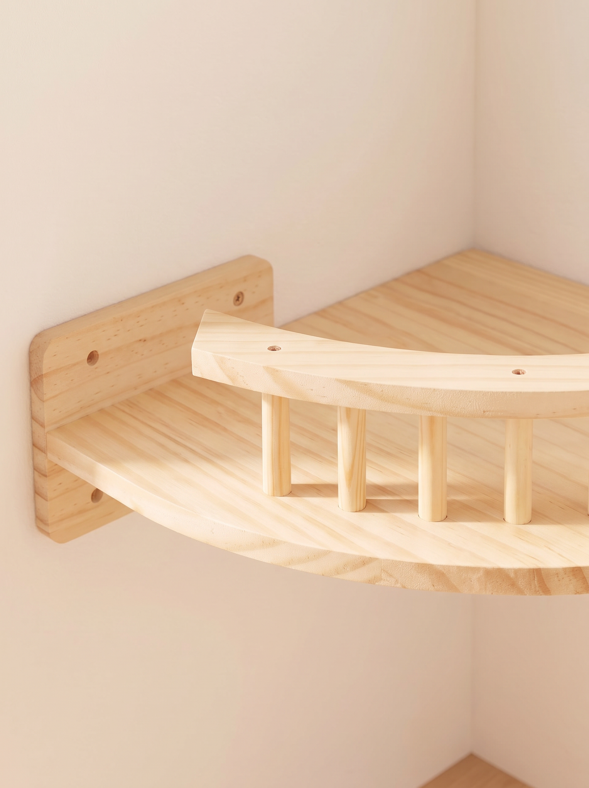 Close-up of the turned dowel rail and pine wall plate on a corner cat shelf